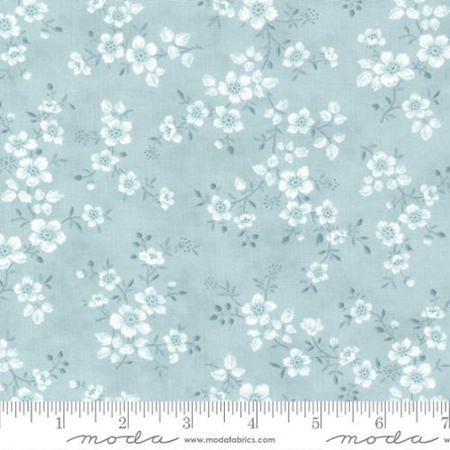 3 Sisters Cascade Sky - Soft blue/grey background with floral sprigs