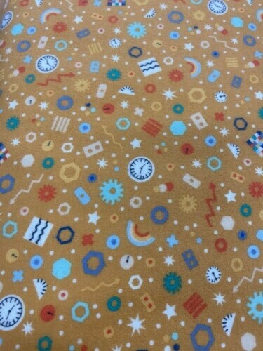 Astrobots Flannel - Small clocks, rainbows, lightening flashes etc on gold background