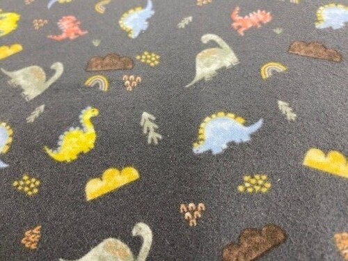 Dinos Flannel - Small blue, rust, yellow & brown dinosaurs