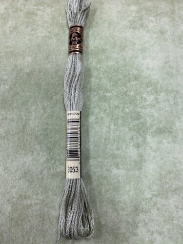 Shadowplay Flannel - Green Thyme. The colour shown is not true colour - I've sat the DMC stranded cotton on top, which if you happen to have the DMC will give you a better idea. Unfortunately some colours just won't photograph properly!