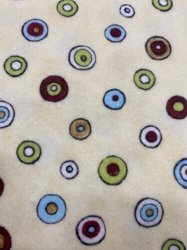 Blizzard Bunch Babies Flannel - Multi coloured circles of red, blue, green & white on cream background